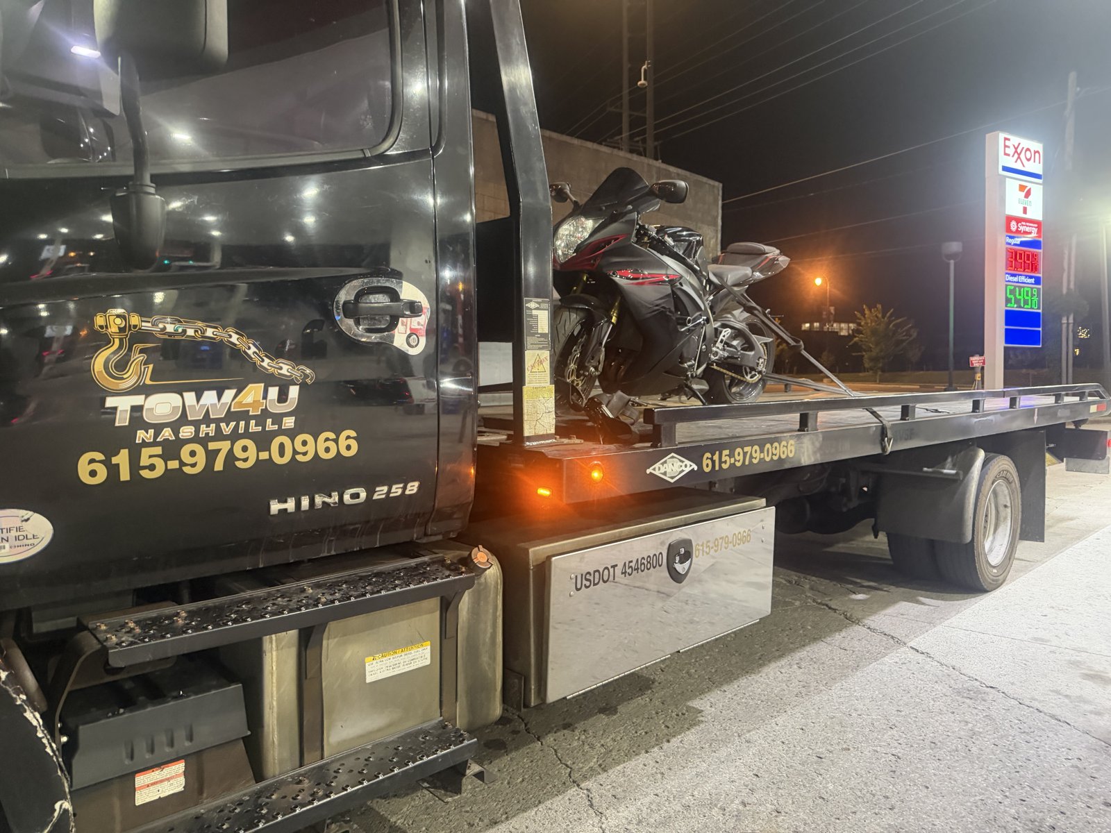 TOW4U after hours motorcycle tow in Nashville on a black Hino 258 flatbed